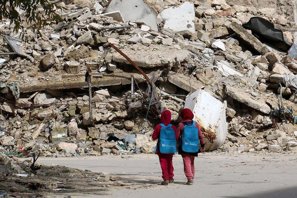 Students+walk+past+rubble+pile+on+their+walk+to+school%0A%0A-Google+Images