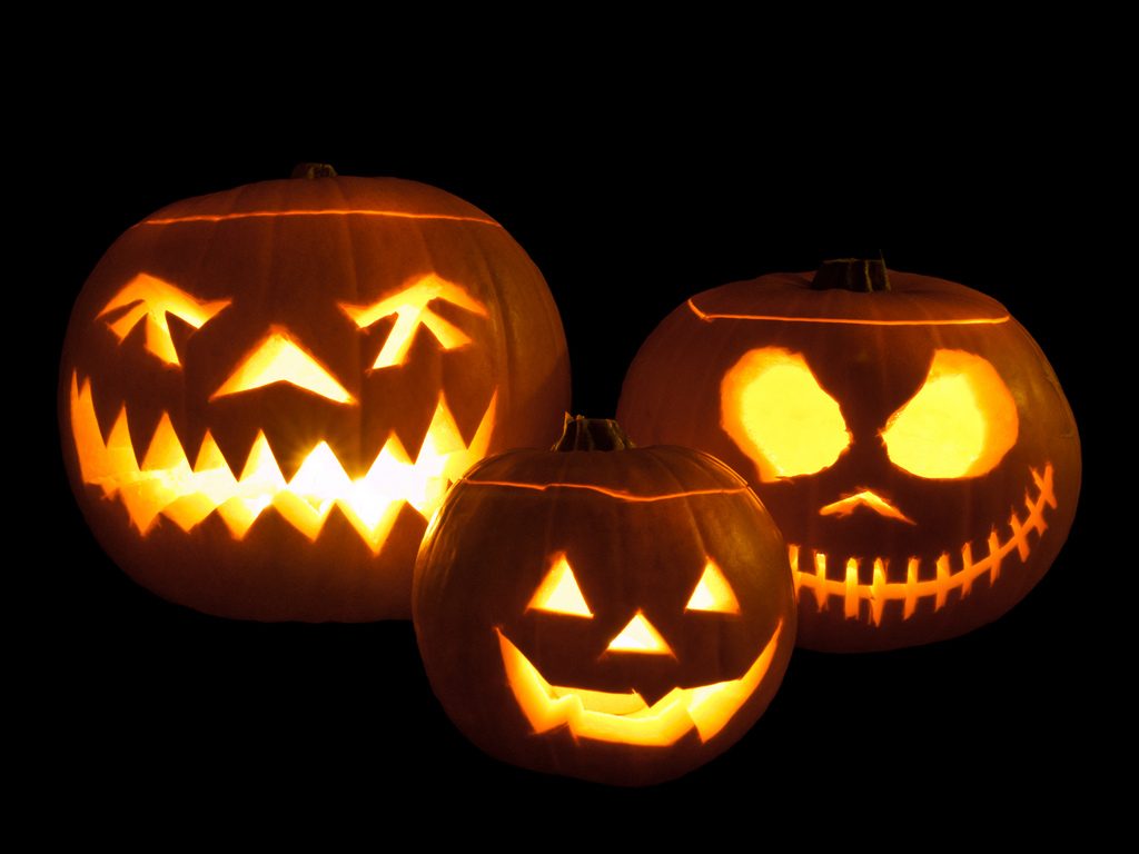 Jack-o%27-lanterns+carved+from+pumpkins+and+lit+with+tea+lights