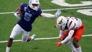 Newsome evading a Virginia Tech defender.