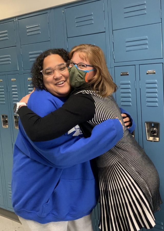 Mrs. May and Senior Bryn Powell embracing a hug.
