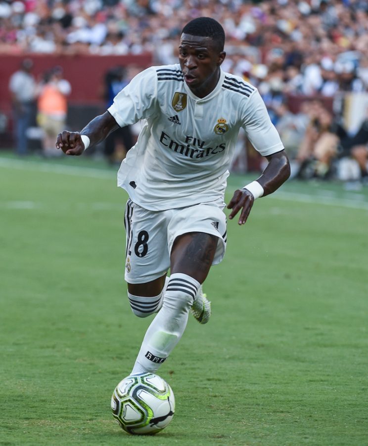 Vinicius Junior dribbling in a 2018 match for Real Madrid.