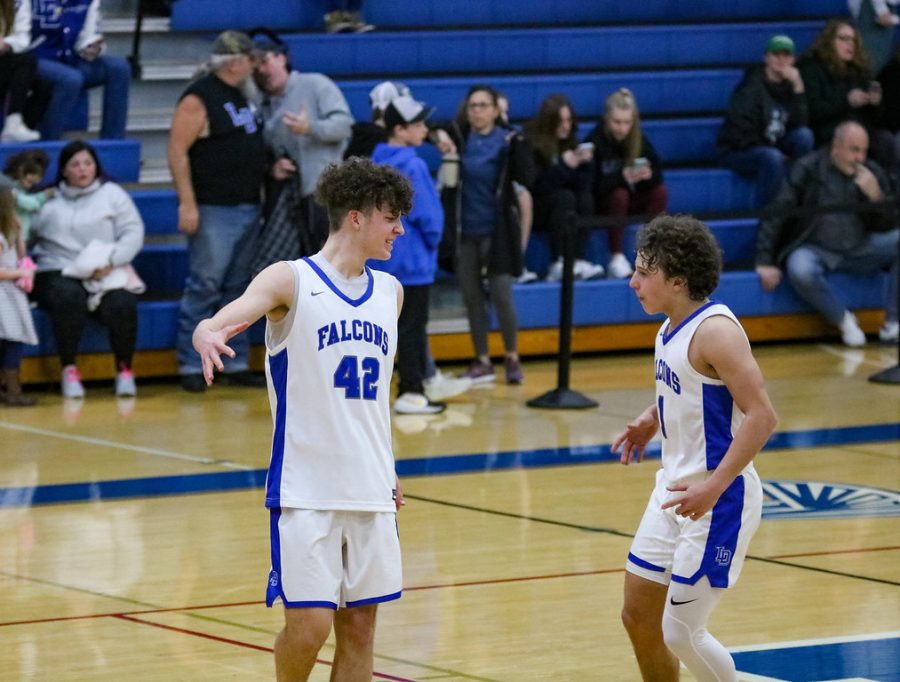 Colton Waters and Charlie Fortney celebrating a play for the Falcons against Hershey.