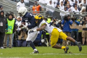 Penn State alumnus and current Commanders WR Jahan Dotson breaking a tackle against Michigan. Dotson is my early pick for the Offensive Rookie of the Year award.