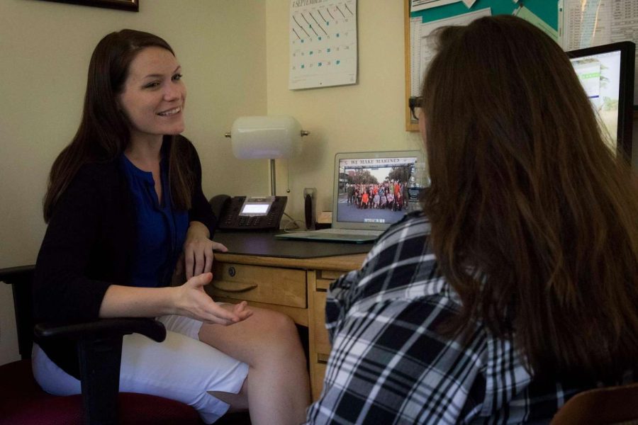 School+counselor+talking+to+a+student.