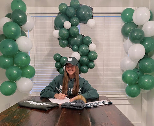 Senior Brynn Shaffer signing her National Letter of Intent (NLI).