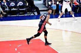 Jimmy Butler smirking down the court after a tough bucket.