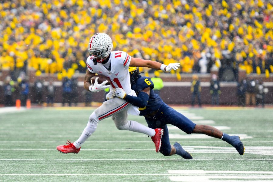 Former Ohio State receiver Jaxon Smith-Njigba shedding a tackle. Smith-Njigba was selected with the 20th pick in the 2023 NFL Draft. (Photo reproduced by permission of MGoBlog/Flickr.com)