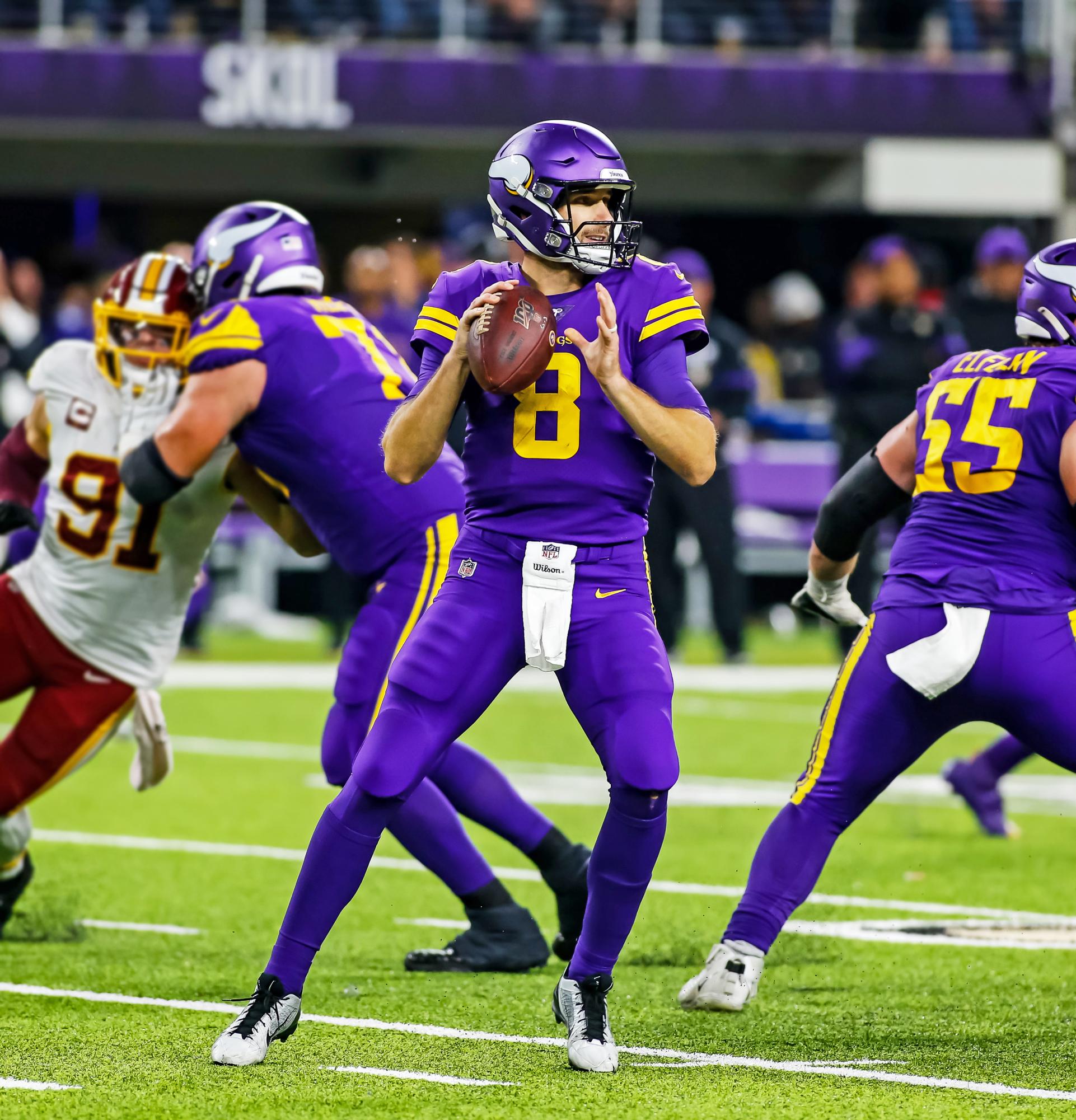 Minnesota Vikings QB Kirk Cousins dropping back to pass in a game against the Washington Commanders. Cousins is my early pick to beMost Valuable Player (MVP). 