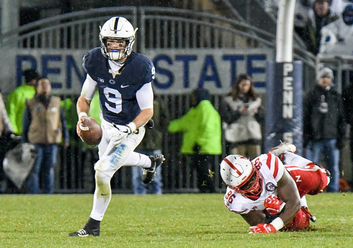 Former Penn State QB Trace McSorley evades pressure in a 2017 game against Nebraska. McSorley was recently signed by the Pittsburgh Steelers following an injury to starter Kenny Pickett. 