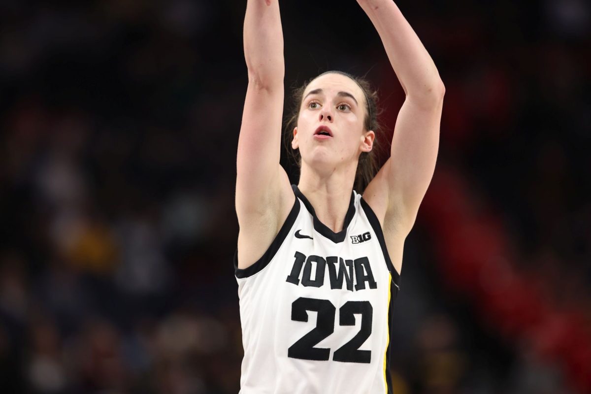 Iowas+Caitlin+Clark+shoots+a+three+pointer+in+a+2023+Hawkeye+game+against+Purdue.+Clark%2C+the+number+one+overall+pick+in+the+2024+WNBA+Draft%2C+has+already+had+a+tremendous+impact+on+the+growth+of+womens+basketball.