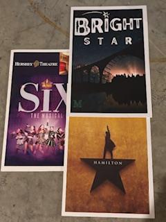 This photo shows playbills of different musicals you can see on Broadway!